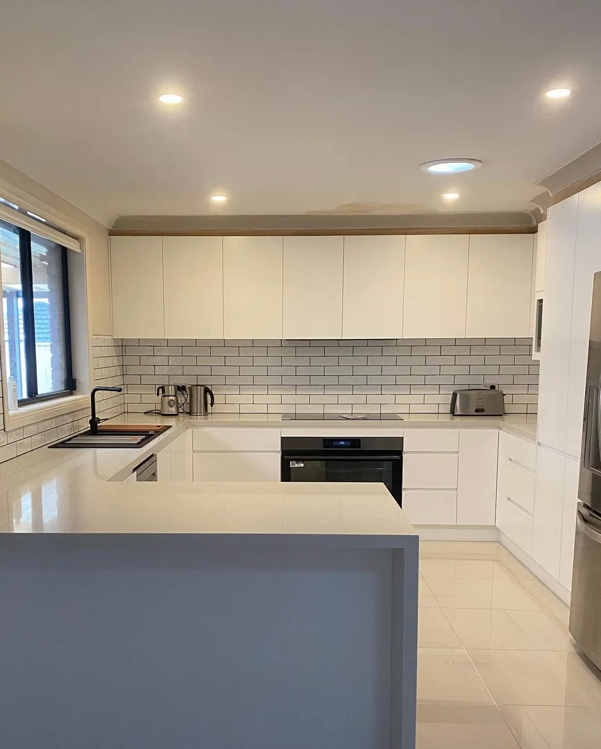 Modern white kitchen with subway tile backsplash